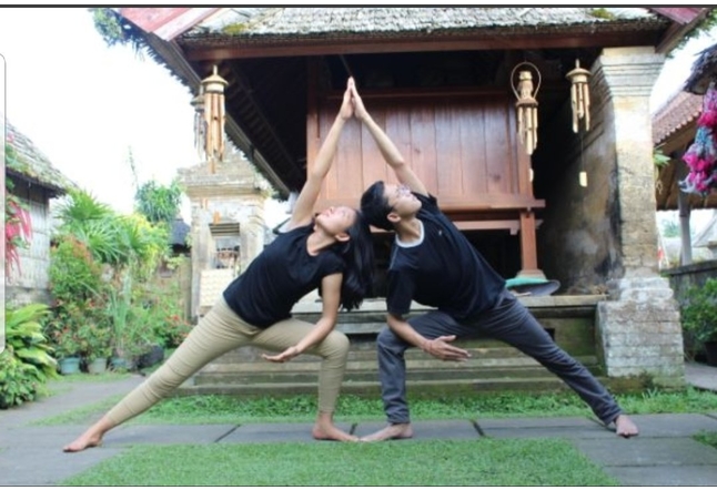 Couple doing yoga outdoor Yoga Studios Ubud Classes Practice Bali