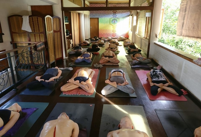 people laying down on yoga mat Yoga Studios Ubud Classes Practice Bali