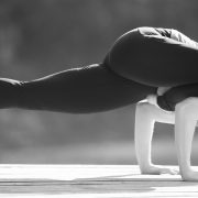 women in a yoga asana flying pigeon pose