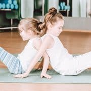 two young girls practicing yoga for ADHD help heal adults add and