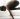 women in a yoga pose on a mat in studio kakasana bakasana meaning