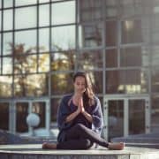 woman praying outside sitting yin yoga styles introduction basics what is benefits of yin yoga