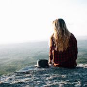 womaN SITTING OUTDOOR ON A ROCK how to get into a meditative state, how to enter easiest way to get into deep state meditation