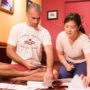 Bryan Kest and Christine Fang discussing Power Yoga business strategy at Santa Monica Power Yoga studio, highlighting the donation-based model and grassroots entrepreneurship.