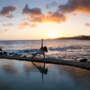 woman practicing yoga outdoor sunset spiritual meaning