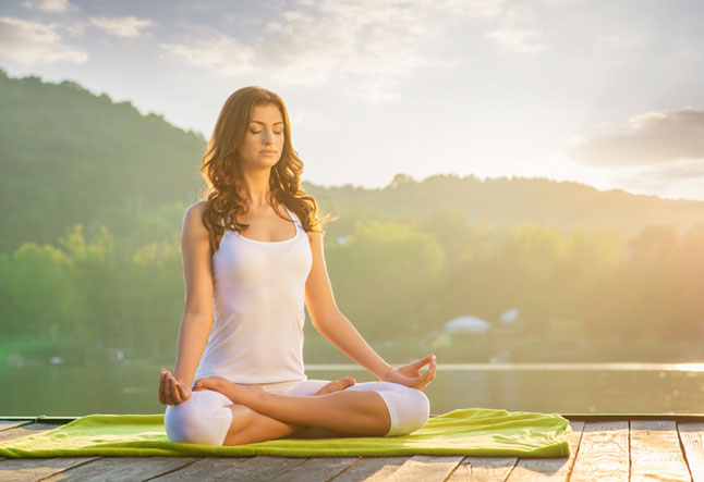 woman sitting in lotus pose yoga benefits for skin benefits of yoga for skin for healthy skin for clear skin