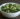 raw kale salad with feta, pine nuts, and cranberries