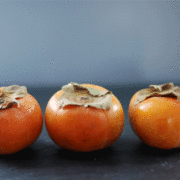 persimmon and pomegranate salad with arugula and hazelnuts