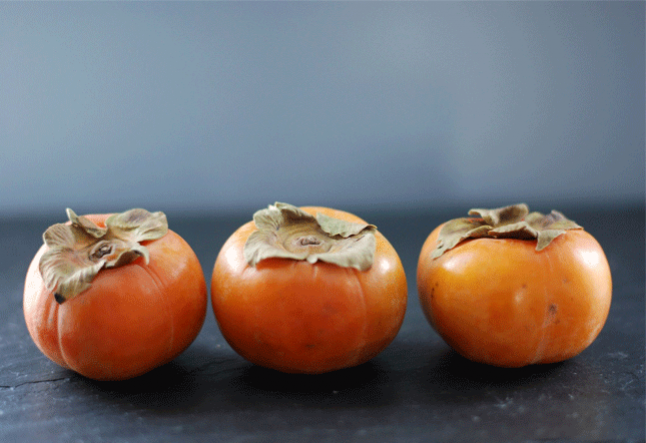 persimmon and pomegranate salad with arugula and hazelnuts