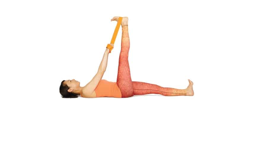 woman laying on floor yoga Reclining Hand-to-Big-Toe Pose lower back pain relieve