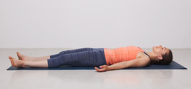 savasana – corpse pose Photo Credit Chopra SHavasana yoga poses for sciatica pain relief asanas best natural yoga