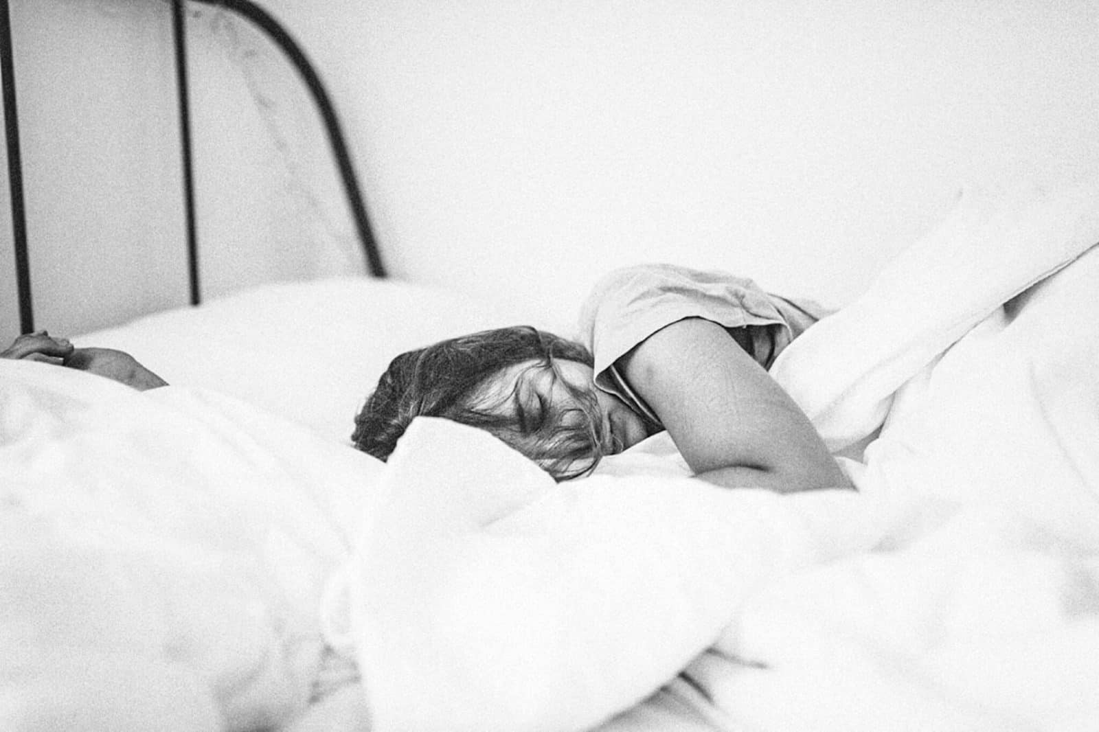 woman sleeping in bed yoga nidra for self heal insomnia