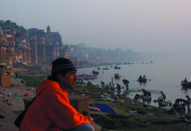 Man in front of River India Eric Hiss writer