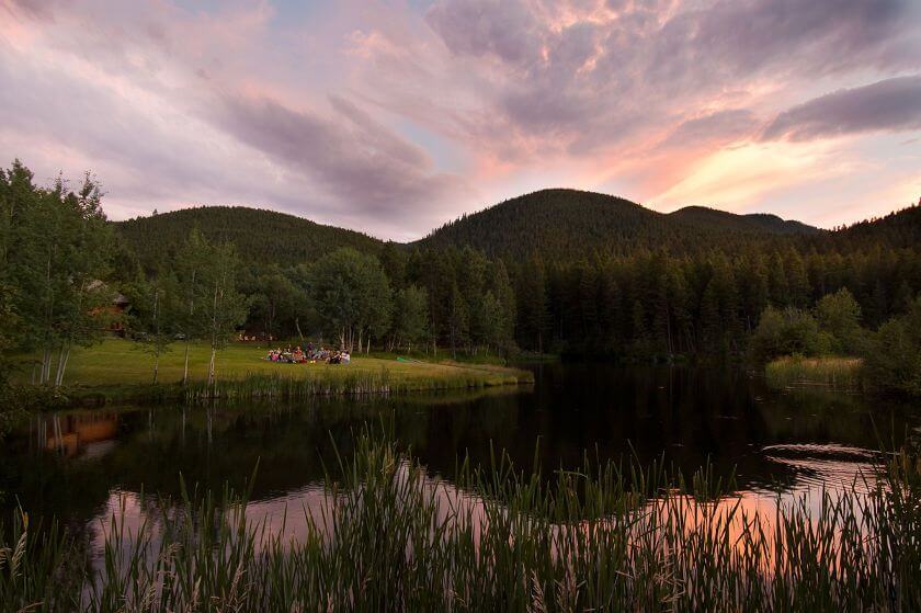 small lake sunset feather pipe