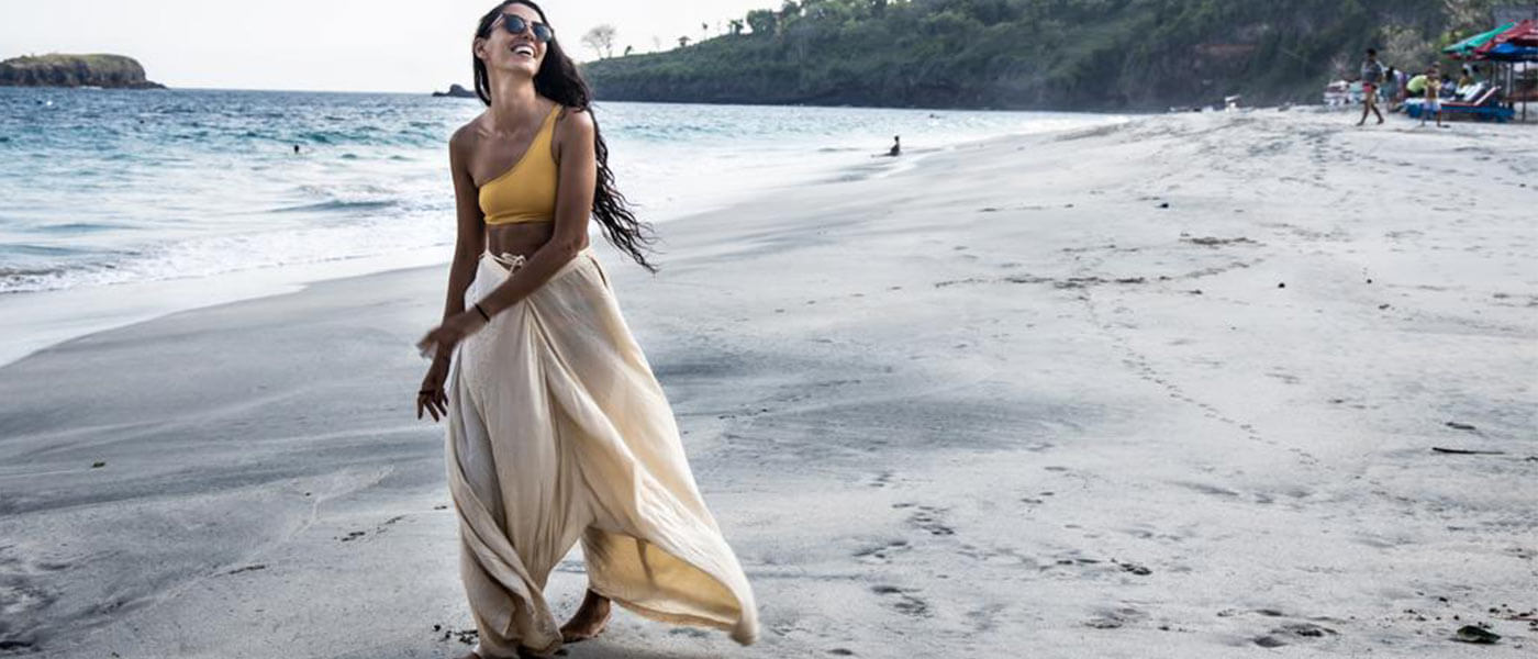 dark hair woman on beach wearing one piece outfits loft jumpsuit sexy jumpsuits for women cute jumpsuits cute rompers romper