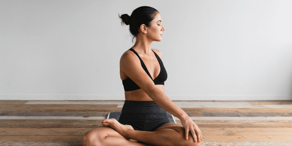 woman practising yoga certification instructor training at home