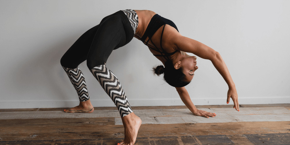 woman practising yoga instructor training at home