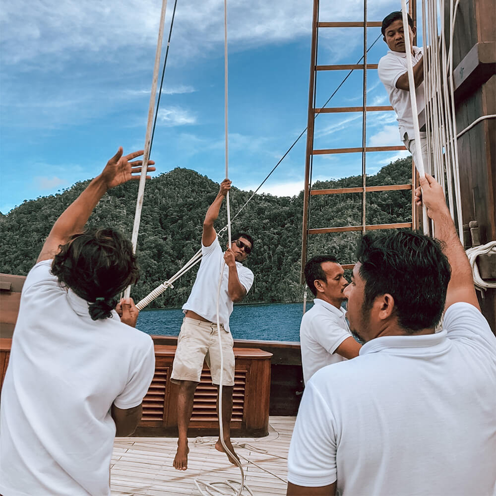 sailors lifting on wooden boat liveaboard indonesia bali yacht