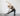 woman practicing gate pose, side gate, yoga gate pose, parighasana, kneeling yoga poses side body stretch spinal wave