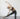 woman practicing gate pose, side gate, yoga gate pose, parighasana, kneeling yoga poses side body stretch spinal wave