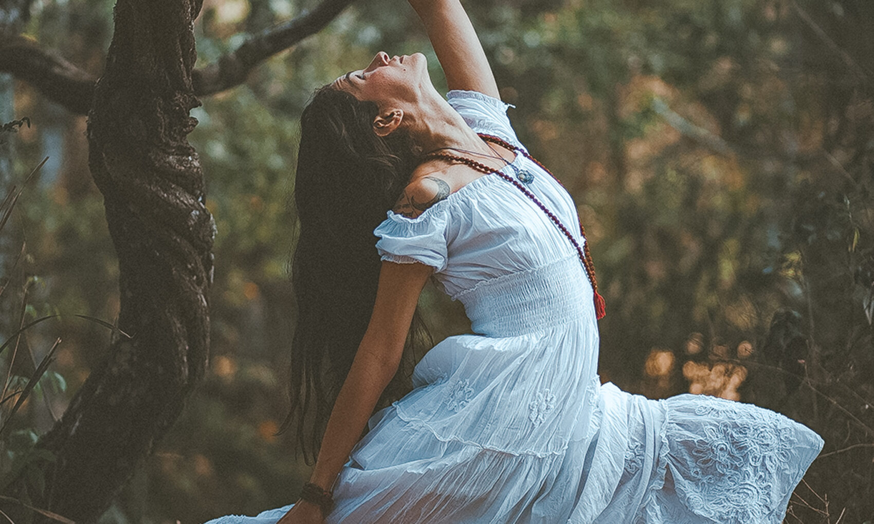 yogini in blue dress with mala what is a yogi definition yogis meaning yogiste