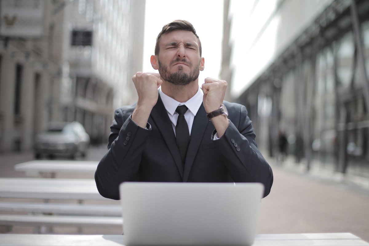 man business suit computer in city center