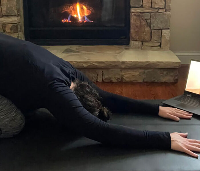lauren studying for myvinyasa practice online teacher training at home