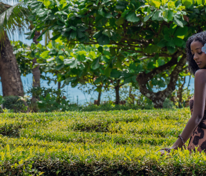 A woman in a lush garden, symbolizing Bali's natural beauty for a mind-body and spirit reset