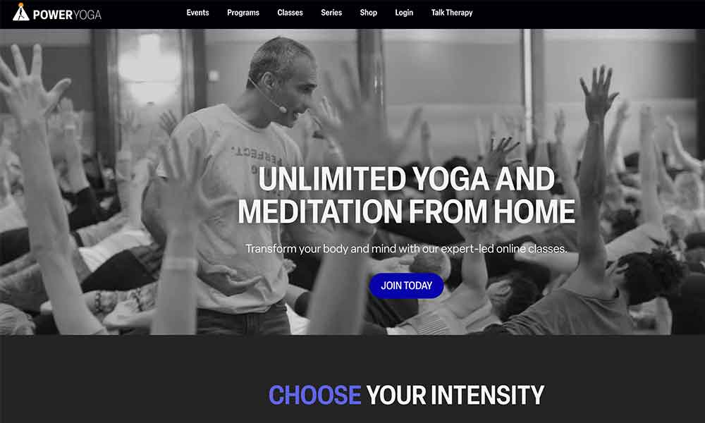 Screenshot of PowerYoga.com homepage featuring the slogan "The Ultimate Mind Body Exercise" with unlimited yoga, meditation, and live streaming classes led by Bryan Kest.