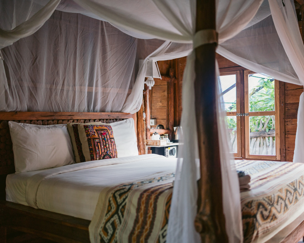 Comfortable and serene private room at a Bali yoga retreat, offering a peaceful space for relaxation and spiritual renewal after daily yoga sessions