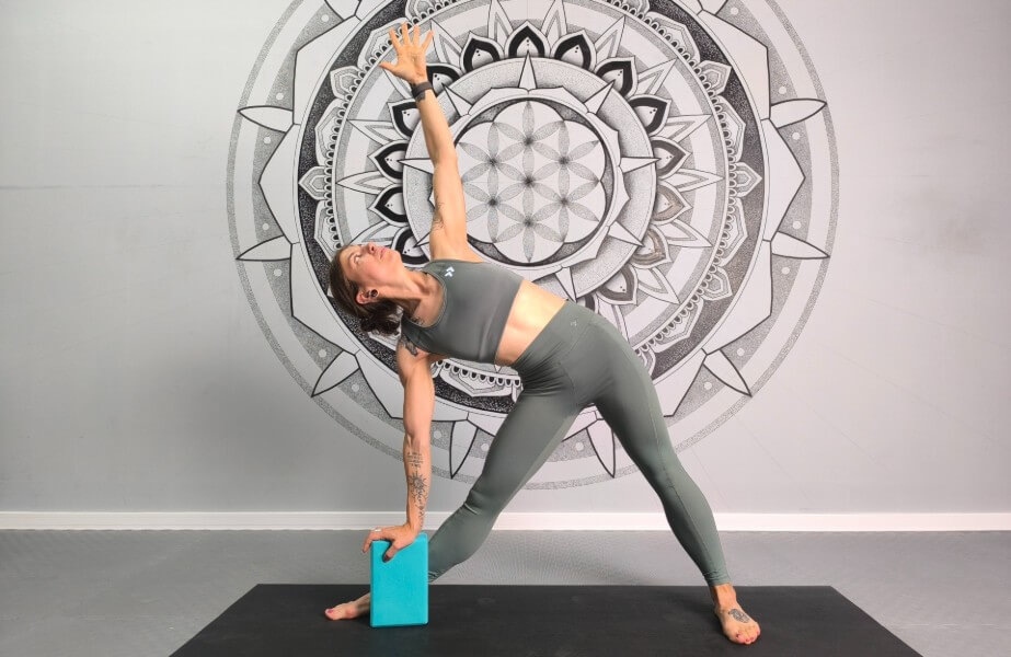 Master Triangle Pose (Trikonasana) — a classic yoga posture that opens the hips and chest while strengthening the legs and improving balance.