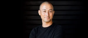 Tamal Dodge, yoga teacher and meditation instructor, portrait with arms crossed.