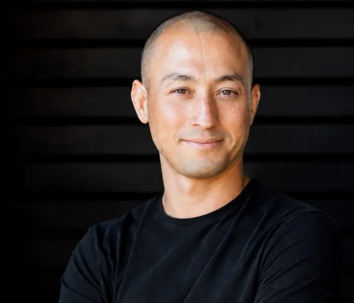 Tamal Dodge, yoga teacher and meditation instructor, portrait with arms crossed.