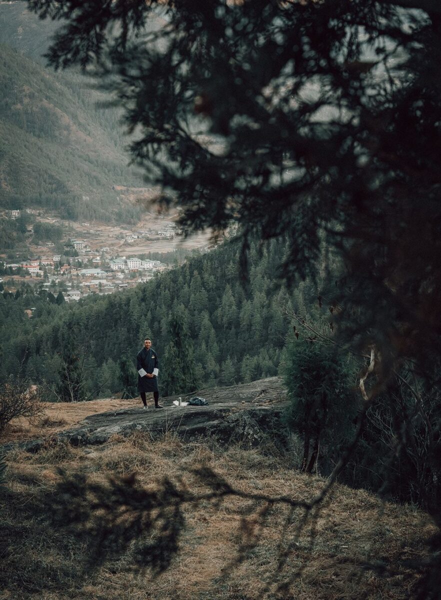 View over the Paro Valley in Bhutan after a short hike to a local monastery, enjoying tea while overlooking the forested mountains and village below.